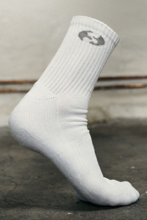 White sock with a logo on a gray background
